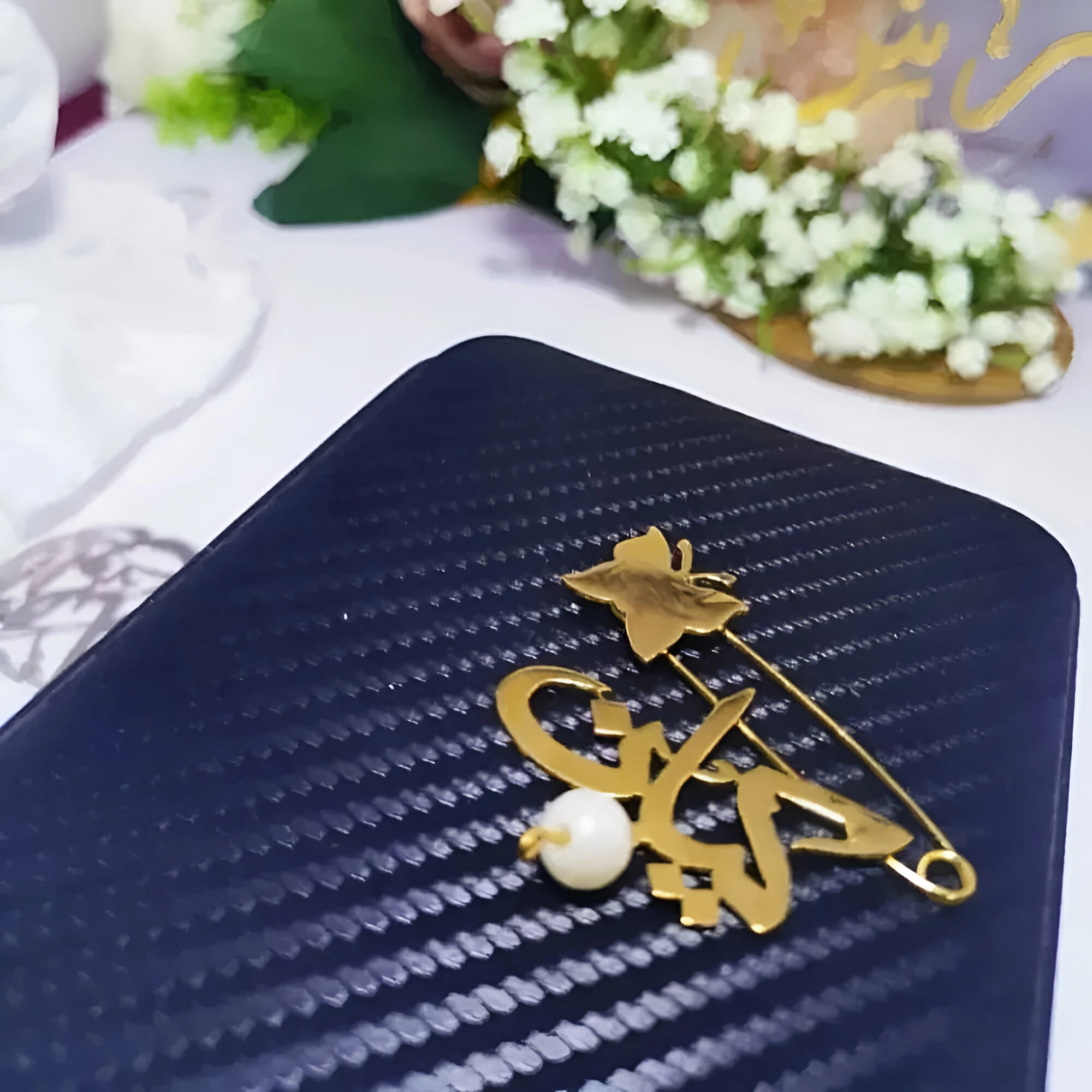 بروش مواليد مطلي ذهب زراير بالاسم الرياض